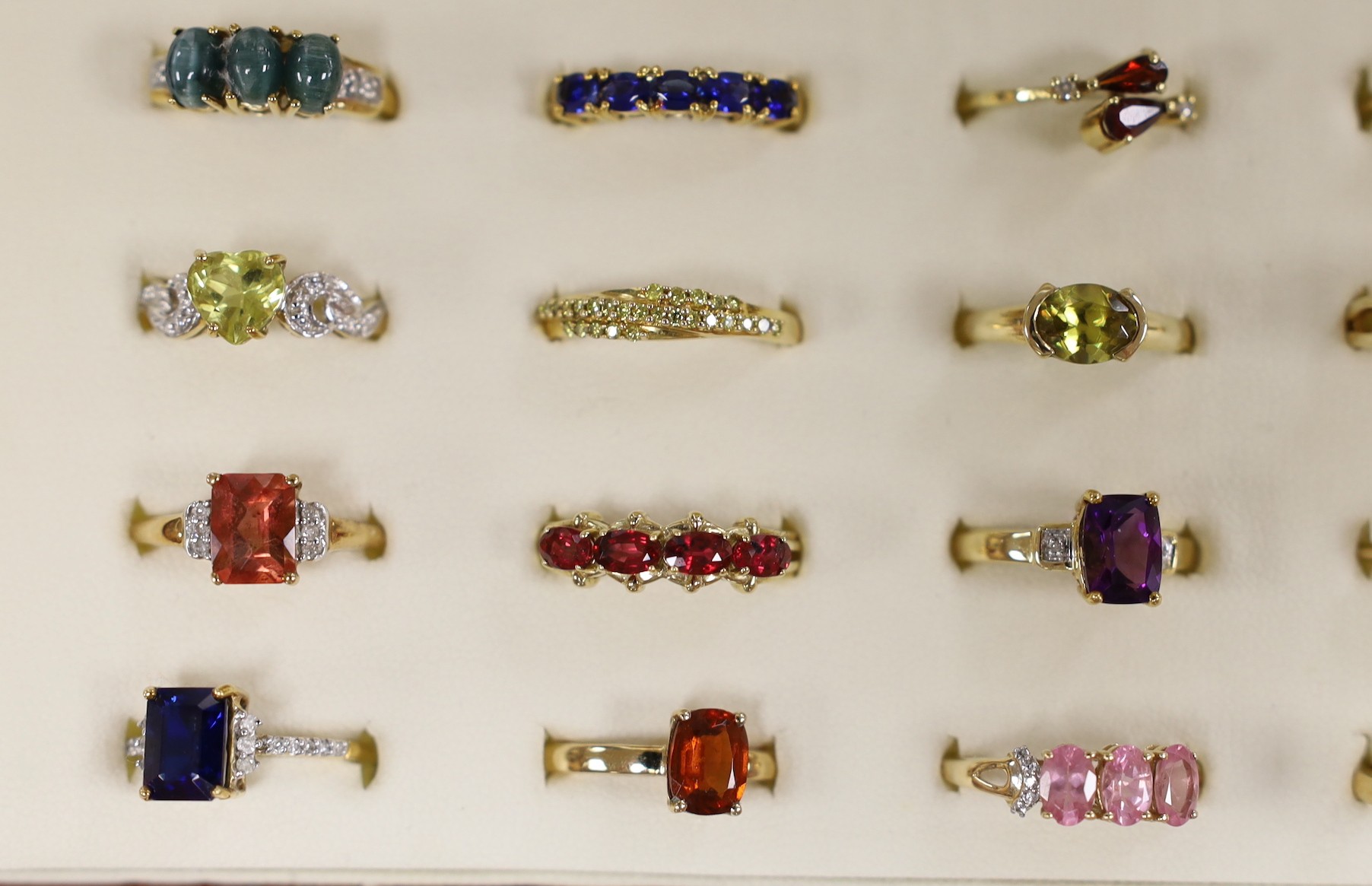 Thirty nine assorted modern 9ct gold and gem set dress rings, including amethyst and garnet and two 18ct gold and gem set rings, in ring box.